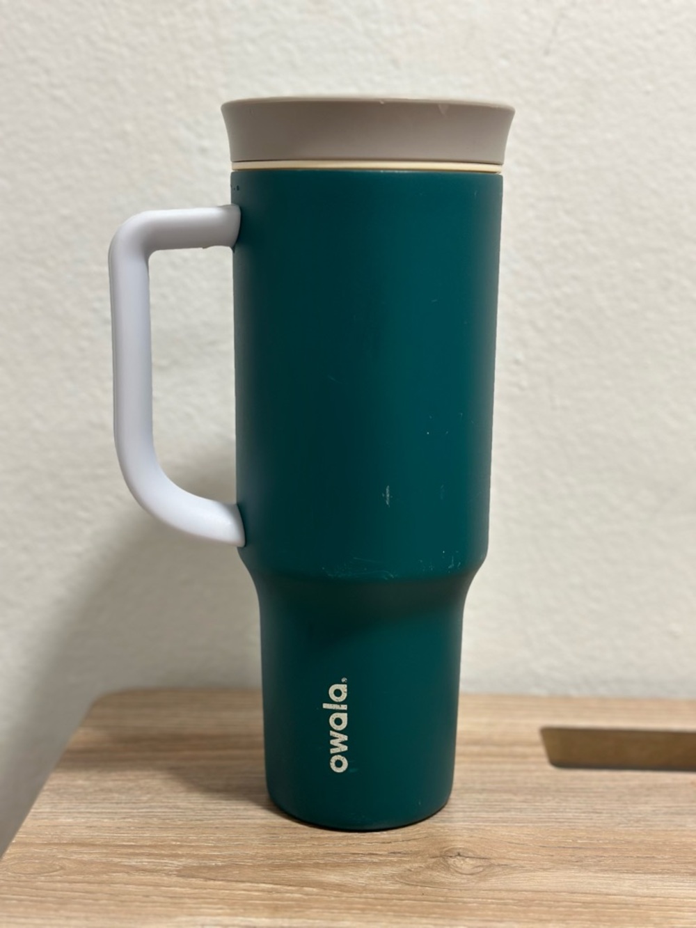 Owala Teal Travel Mug with White Handle and Beige Lid